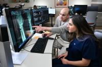 Two physicians looking at an X-ray